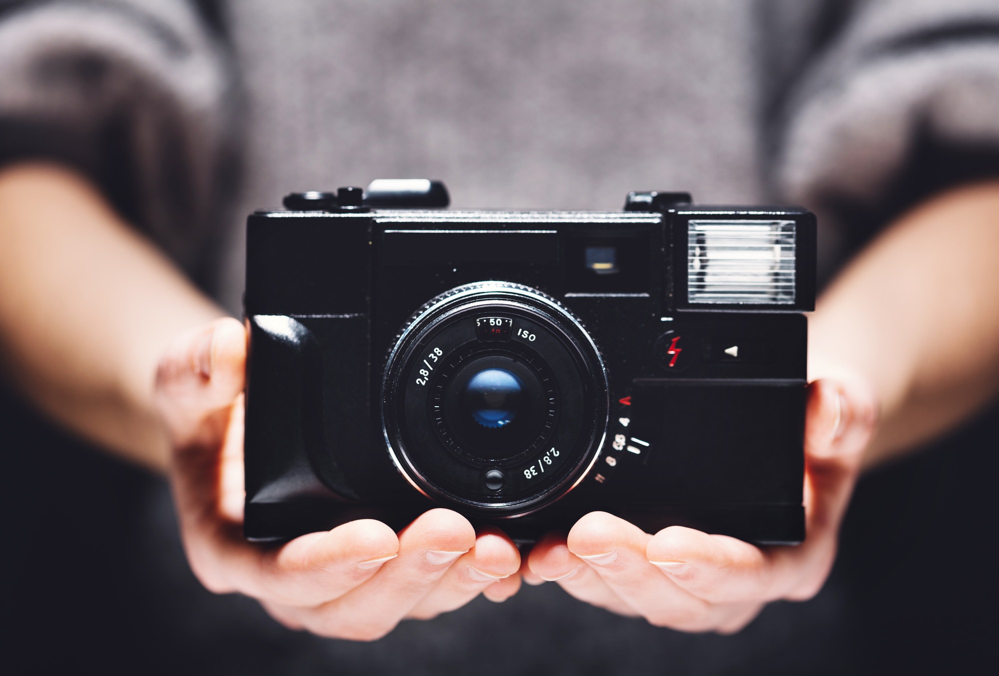 retro-camera-in-woman-s-hands-photography.jpg
